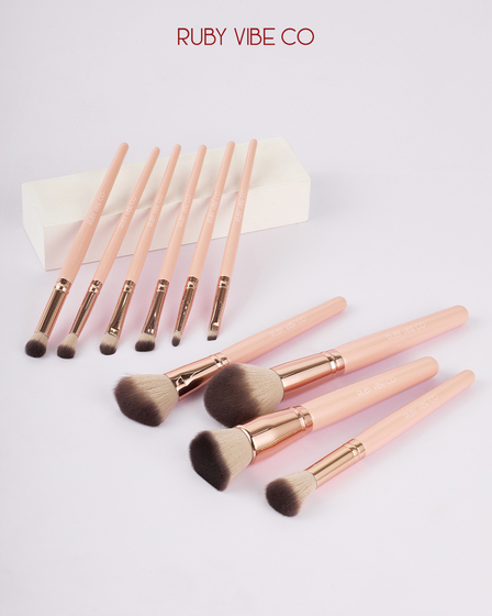 Professional studio photography showcasing the full Ruby Vibe Co makeup brush collection
