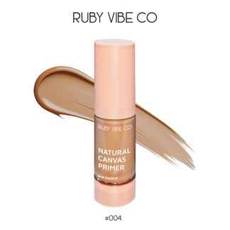 A stick of Ruby Vibe Co Natural Canvas Primer in shade #004 next to a makeup swatch